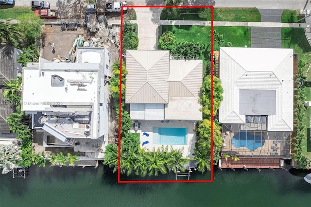 birds eye view of property featuring a water view