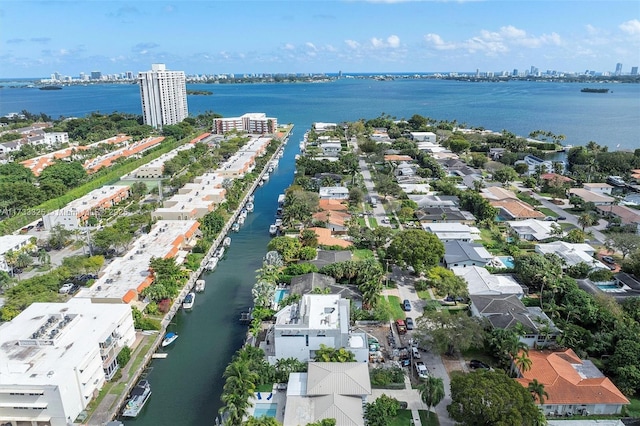 bird's eye view featuring a water view and a city view