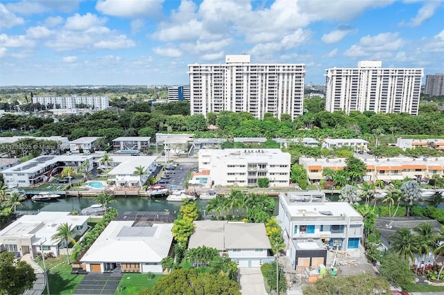 drone / aerial view featuring a water view and a city view