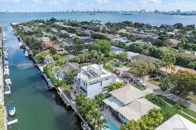 bird's eye view featuring a view of city and a water view