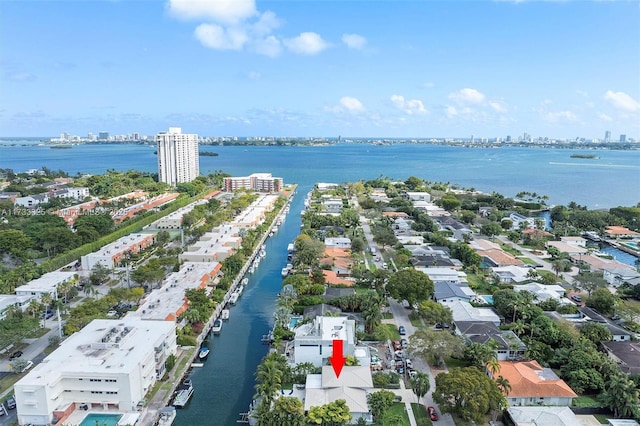 birds eye view of property featuring a view of city and a water view