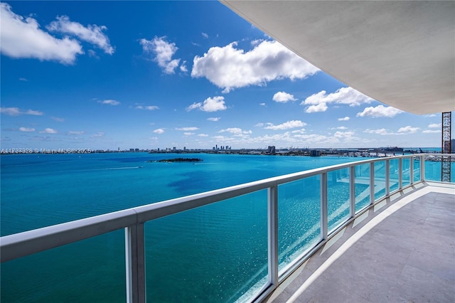 balcony featuring a water view