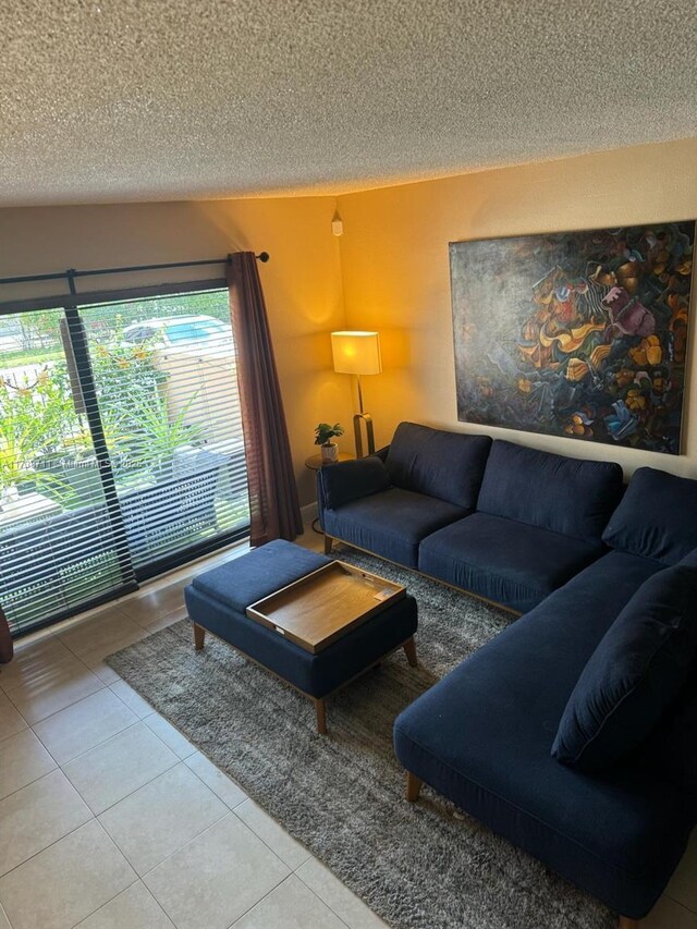 tiled living room with a textured ceiling