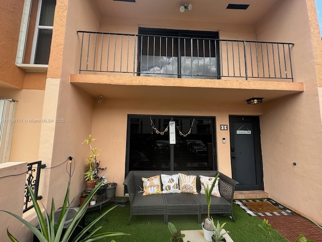 doorway to property featuring a balcony