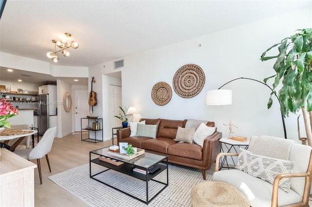 living room with a notable chandelier