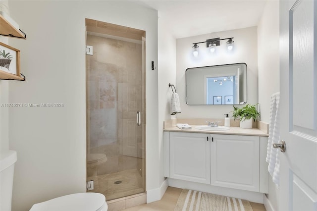 bathroom featuring walk in shower, vanity, and toilet