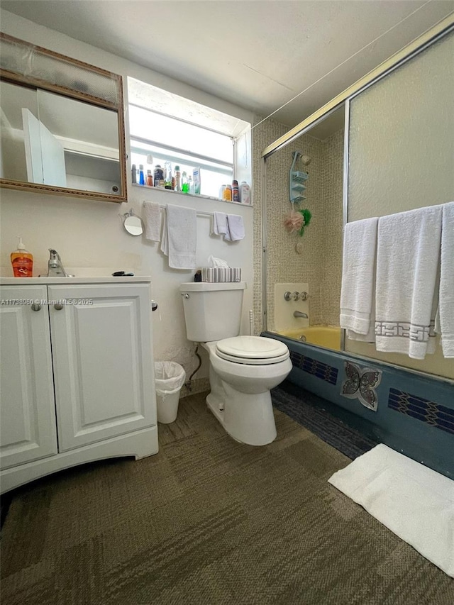 full bathroom with sink, enclosed tub / shower combo, and toilet