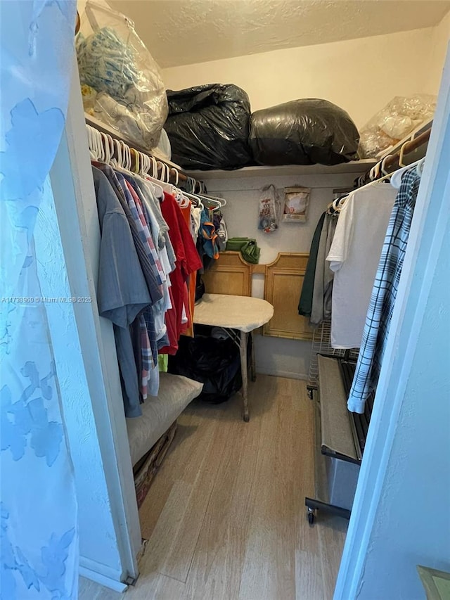 walk in closet featuring light hardwood / wood-style floors