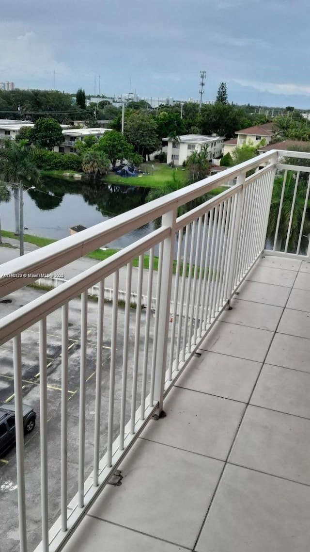 balcony featuring a water view