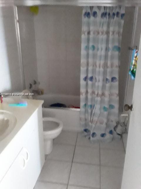 full bathroom with tile patterned flooring, vanity, shower / bath combination with curtain, and toilet