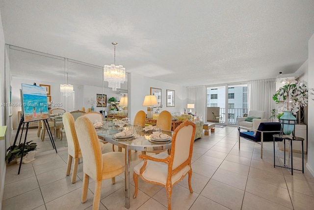 1865 S Ocean Dr Unit 4D, Hallandale Beach, FL 33009 - tiled dining room with expansive windows, an inviting chandelier, and a textured ceiling