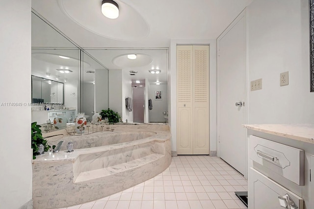 1865 S Ocean Dr Unit 4D, Hallandale Beach, FL 33009 - bathroom with tile patterned flooring, vanity, and tiled tub