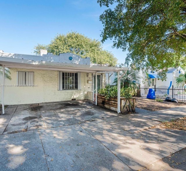 view of front of house with a patio area