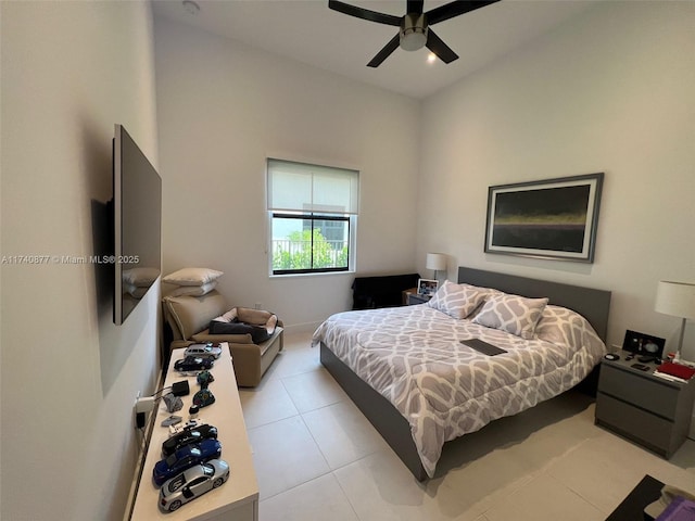 bedroom with light tile patterned floors and ceiling fan