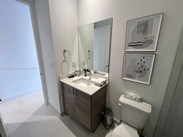 bathroom featuring tile patterned floors, toilet, and vanity