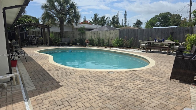 5051 NE 6th Ave, Deerfield Beach, FL 33064 - view of swimming pool featuring a pergola and a patio