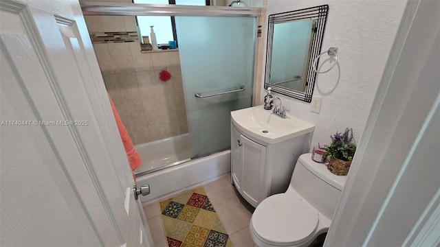 5051 NE 6th Ave, Deerfield Beach, FL 33064 - full bathroom with enclosed tub / shower combo, vanity, tile patterned floors, and toilet