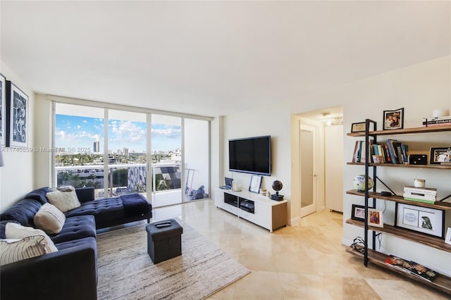 living room featuring floor to ceiling windows