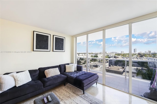 living room featuring plenty of natural light, floor to ceiling windows, and light tile patterned floors