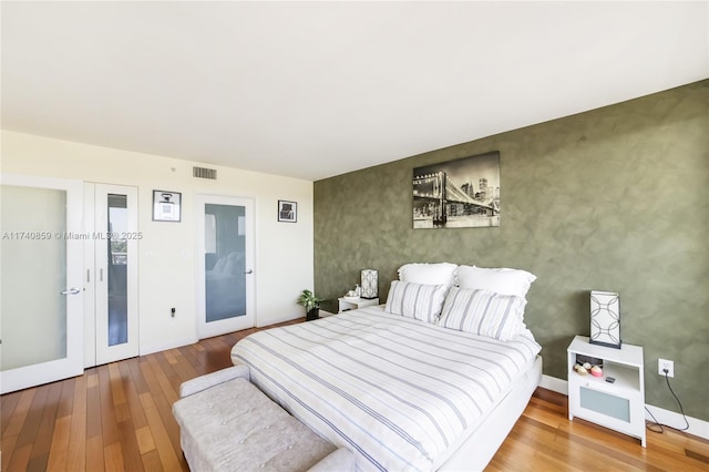 bedroom featuring hardwood / wood-style flooring