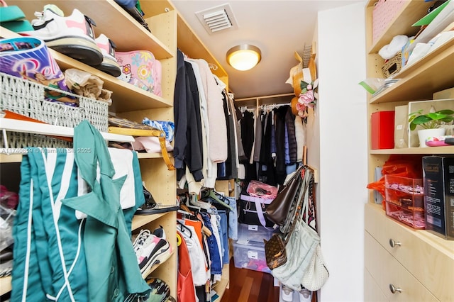 spacious closet featuring hardwood / wood-style floors