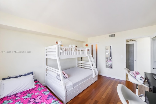 bedroom featuring dark wood-type flooring