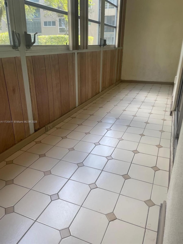 unfurnished sunroom with plenty of natural light