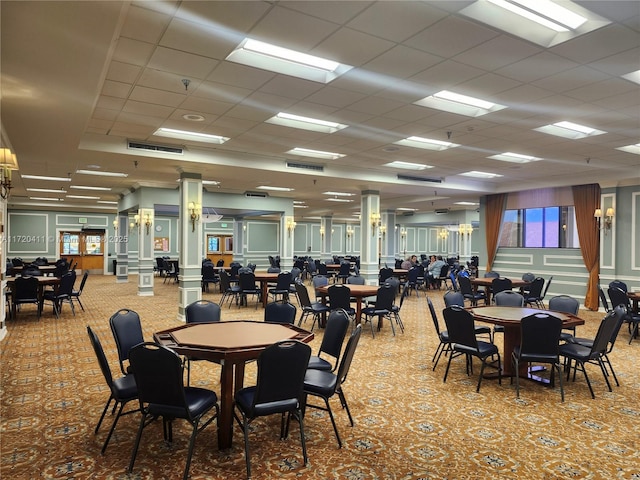 dining area featuring a paneled ceiling