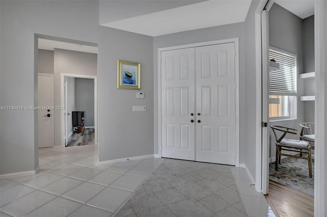 foyer entrance featuring light tile patterned floors