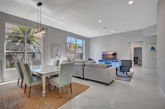 tiled dining area with a notable chandelier