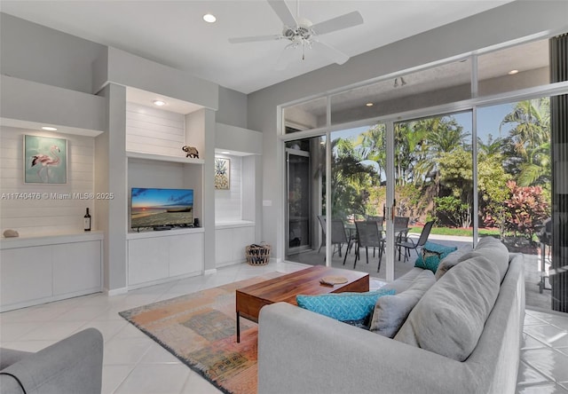 tiled living room featuring ceiling fan