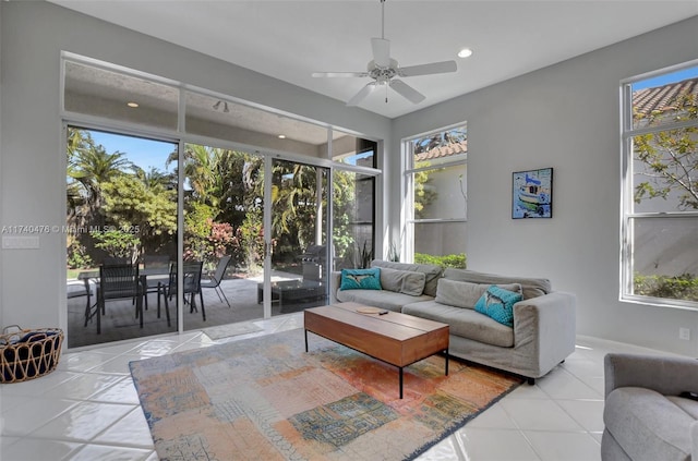 living room featuring ceiling fan and light tile patterned floors