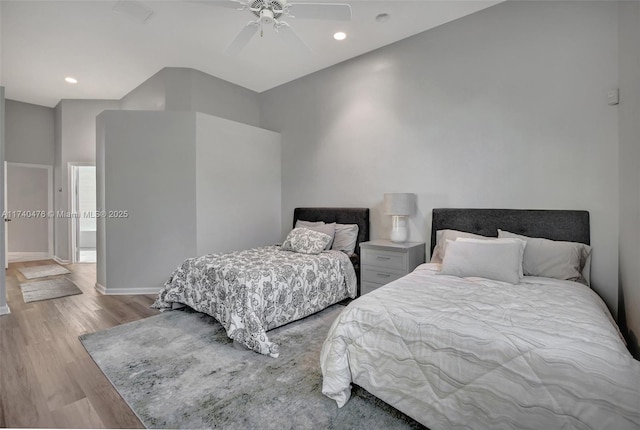 bedroom with ceiling fan and light hardwood / wood-style flooring