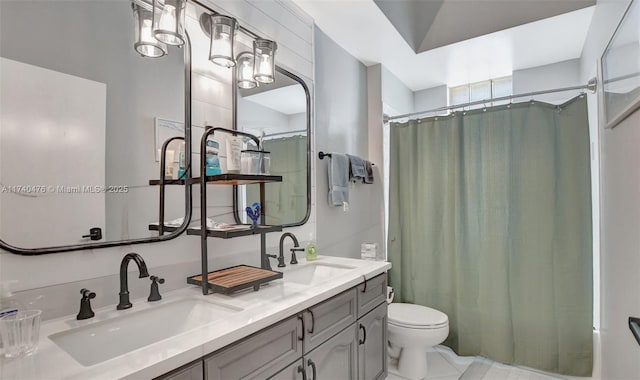 bathroom with vanity, curtained shower, and toilet