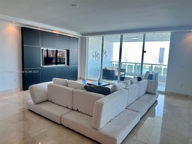 living room featuring floor to ceiling windows