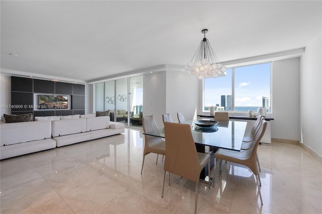 dining area with marble finish floor and baseboards