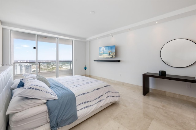 bedroom with access to exterior, baseboards, and floor to ceiling windows