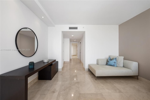 corridor featuring marble finish floor, visible vents, and baseboards