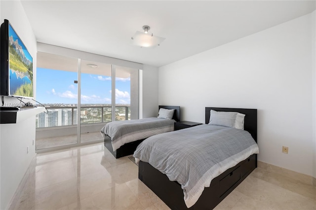 bedroom with floor to ceiling windows