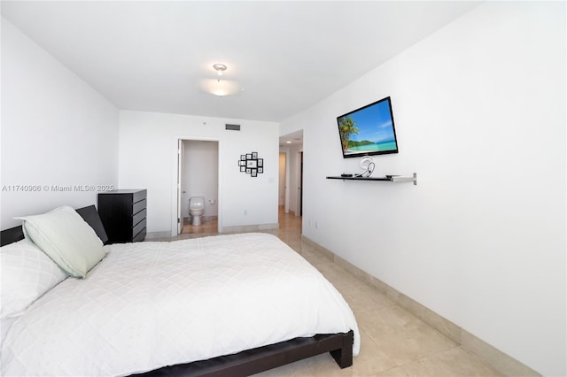 bedroom with light tile patterned floors, baseboards, and visible vents