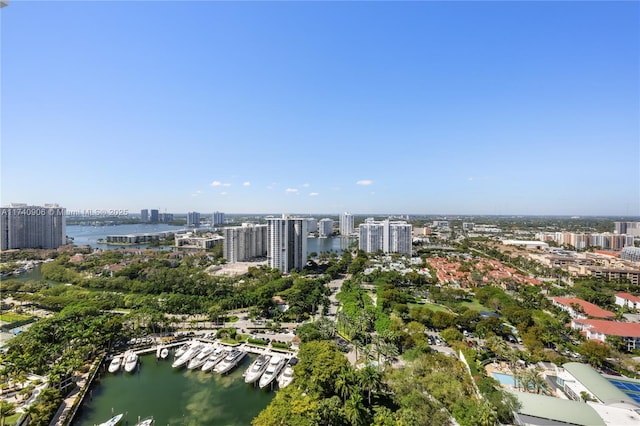 birds eye view of property featuring a view of city and a water view