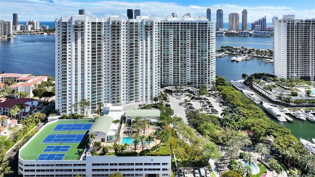 bird's eye view featuring a view of city and a water view