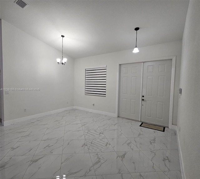 entryway featuring an inviting chandelier