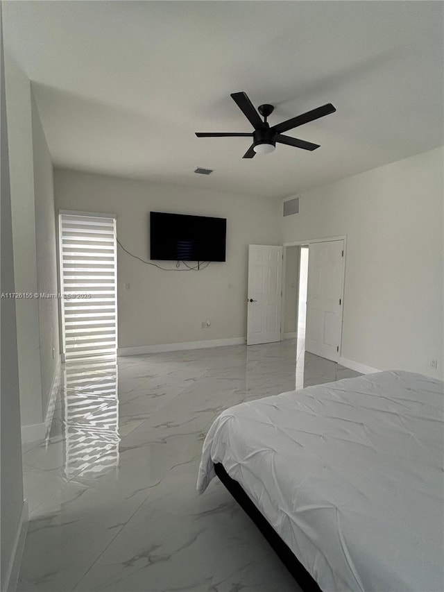 unfurnished bedroom featuring ceiling fan