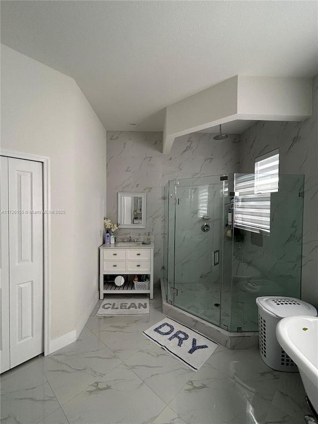 bathroom featuring vanity, a textured ceiling, and walk in shower