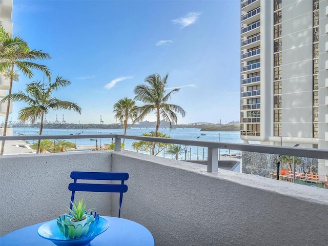 balcony featuring a water view