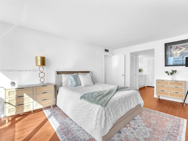 bedroom with hardwood / wood-style floors