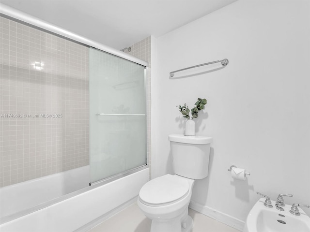 bathroom with a bidet, enclosed tub / shower combo, and toilet