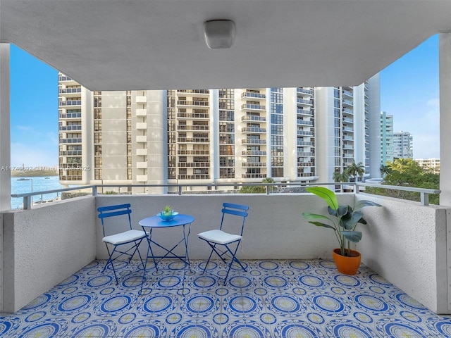 balcony featuring a water view