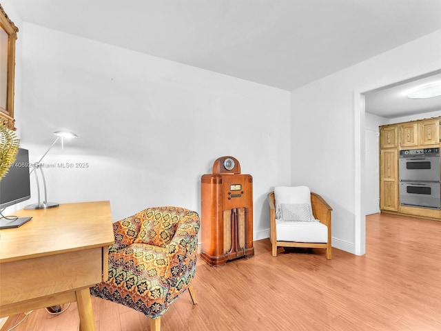 sitting room featuring light hardwood / wood-style flooring